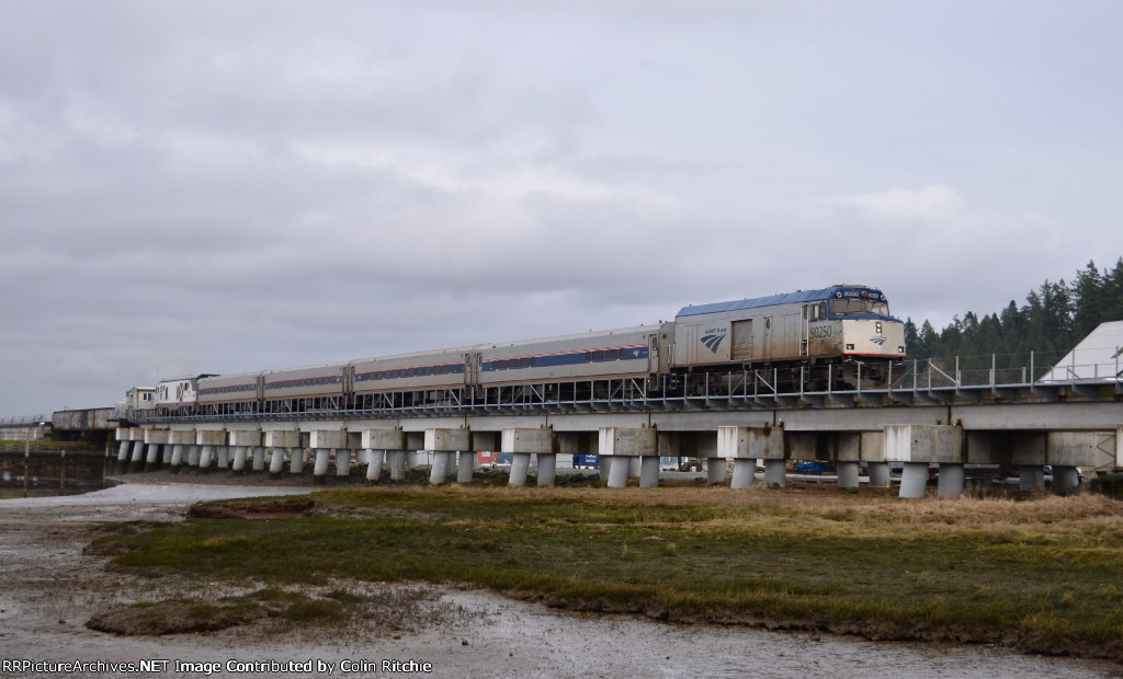 AMTK 90250(NPCU) leading S/B Amtrak re-certification train across the Crescent Beach Marina swing bridge at the south end of Mud Bay Crossing.